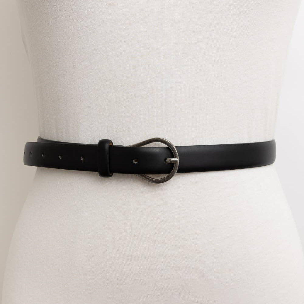 Black belt worn on a white mannequin with a plain background