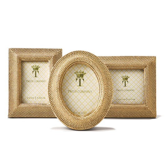 Three gold photo frames with a textured pattern on a white background