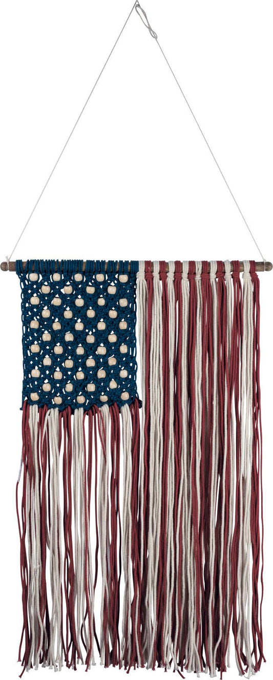 Decorative American flag with fringes hanging against a white background
