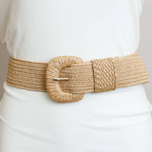 Beige woven belt with a large round buckle on a white outfit